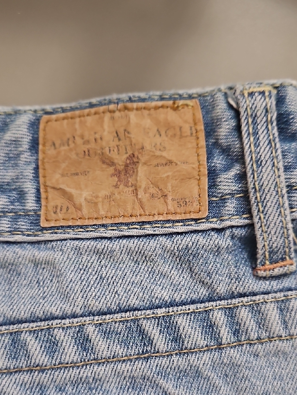 American Eagle | Y2K light denim shorts distressed flap-closure back pockets. 12 - Picture 7 of 13